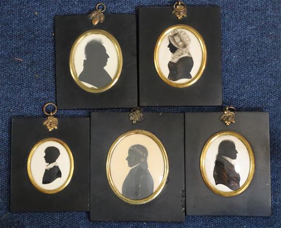 A group of five early 19th century painted and cut paper silhouettes,